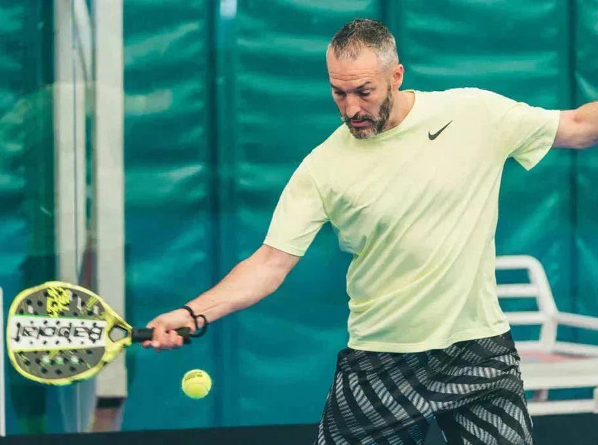 a guy plaing padel tennis