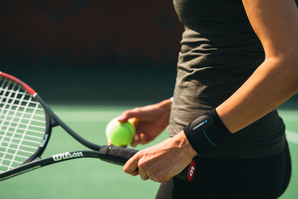 Support during exercise with the Compex Activ'® Wrist Band+ support