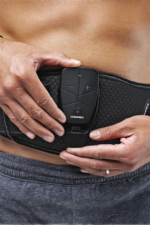 A man putting the device into the Compex Corebelt 3.0 EMS muscle stimulator belt