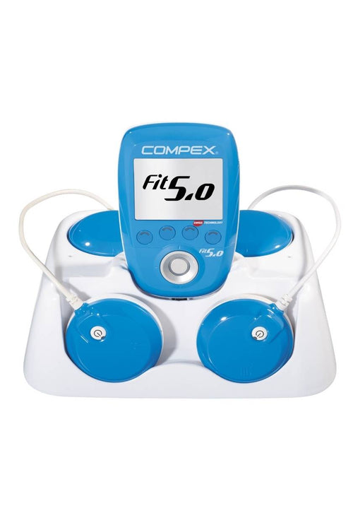 The Compex FIT 5.0 EMS muscle stimulator in its docking station
