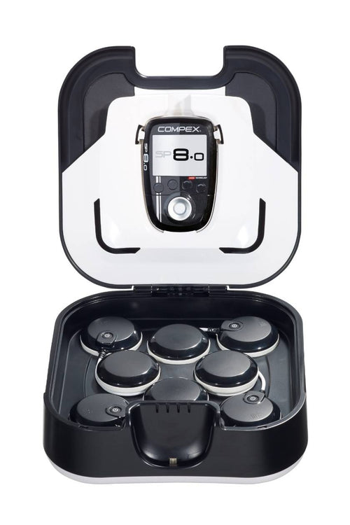 The Compex SP 8.0 EMS muscle stimulators in its docking station