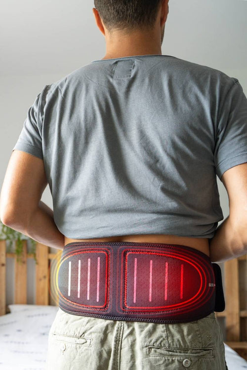 A man using the Compex ComfortTENS Back Wrap