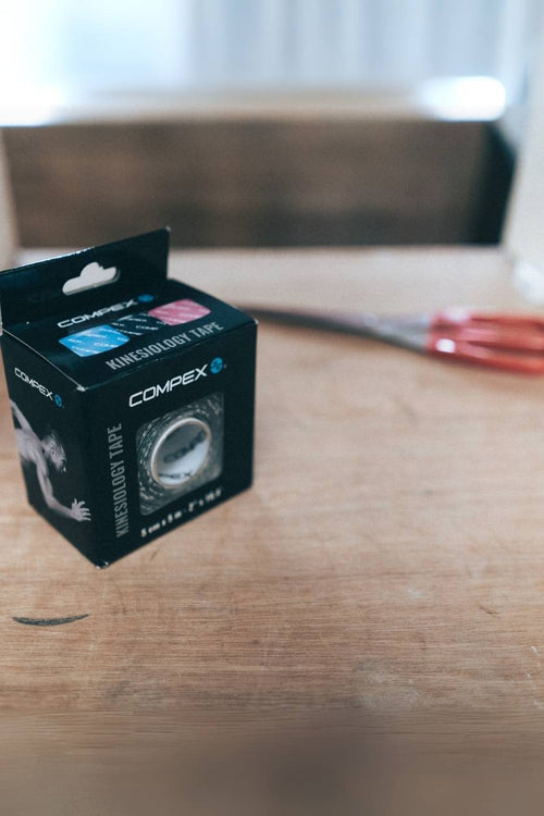 A box of black Compex K-Tape
