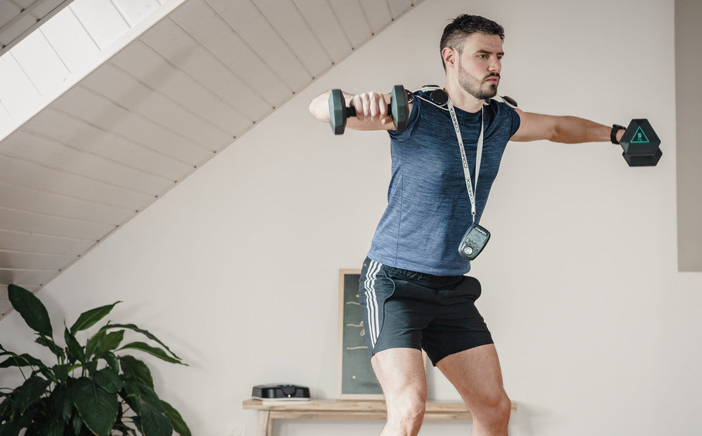 A man improving his muscle volume with the Compex SP 8.0 EMS muscle stimulator
