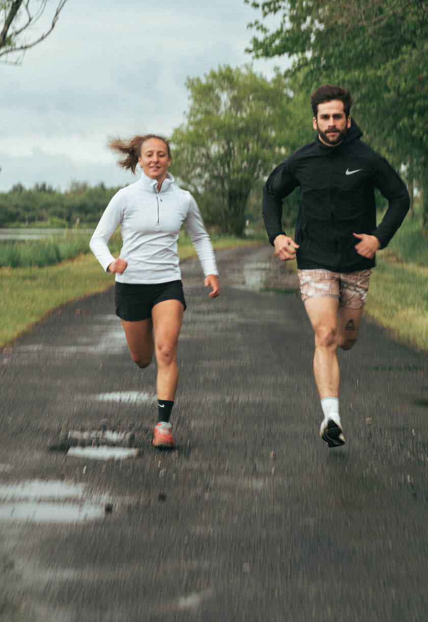 A couple running on a road
