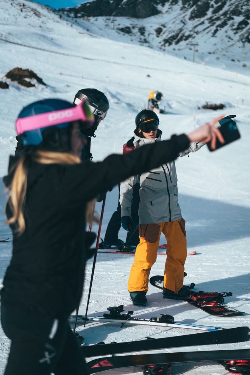 A group of skiers on a ski slope