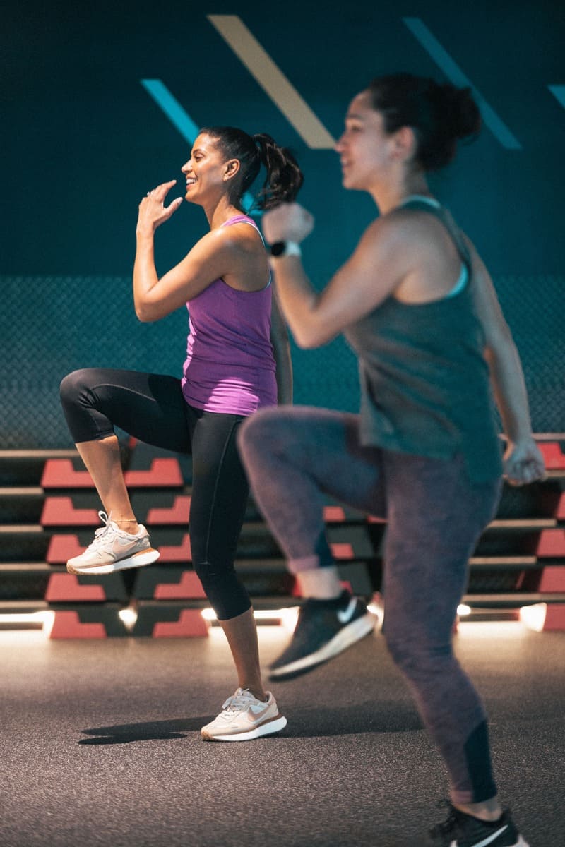 Two women doing a gym class