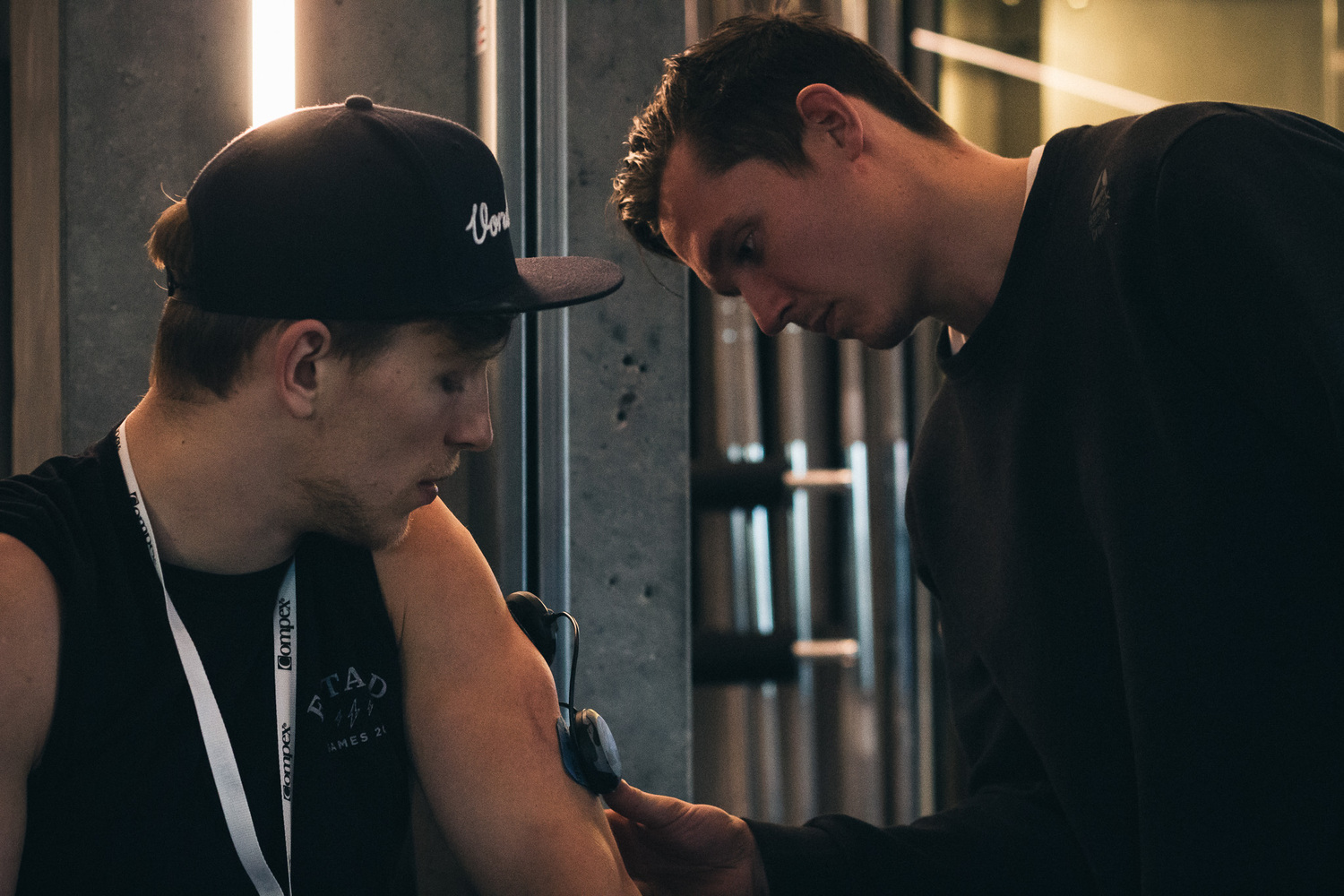 Person helping a person with a compex product